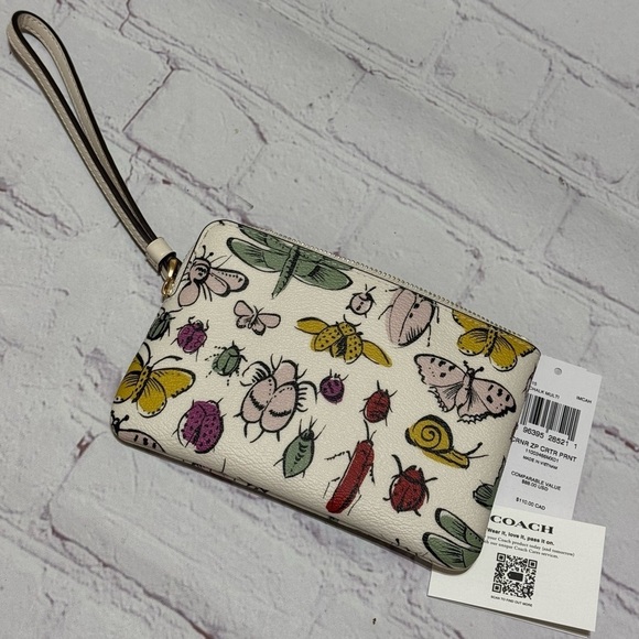 Coach Handbags - COACH Corner Zip Wristlet Signature Canvas With butterflies & critters Print NWT